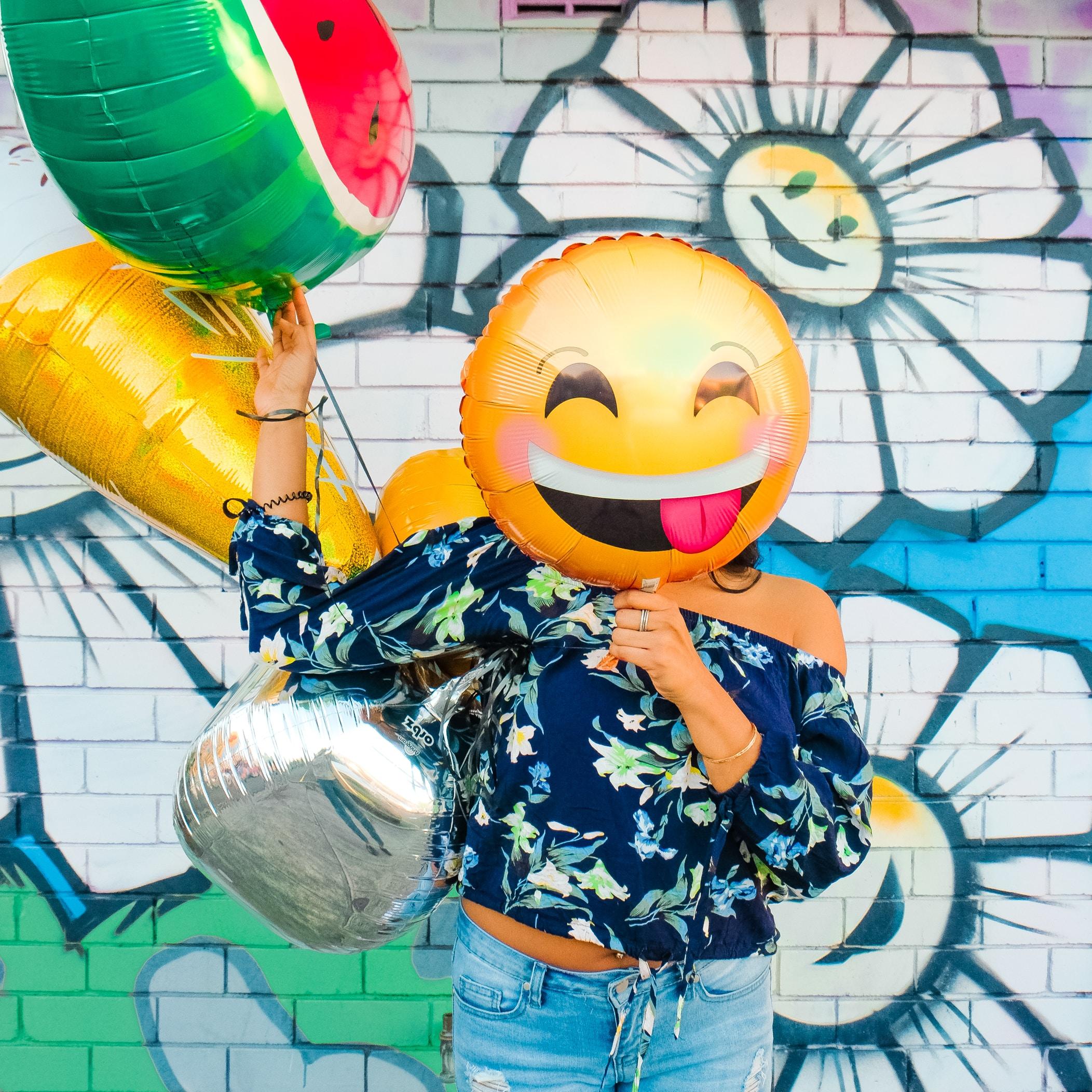 Person with Smiling Balloon